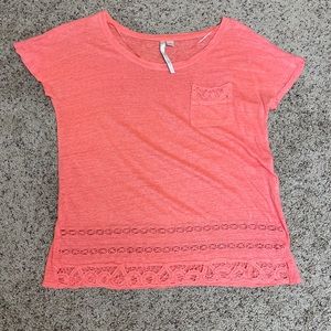 Coral colored top with lacy details
